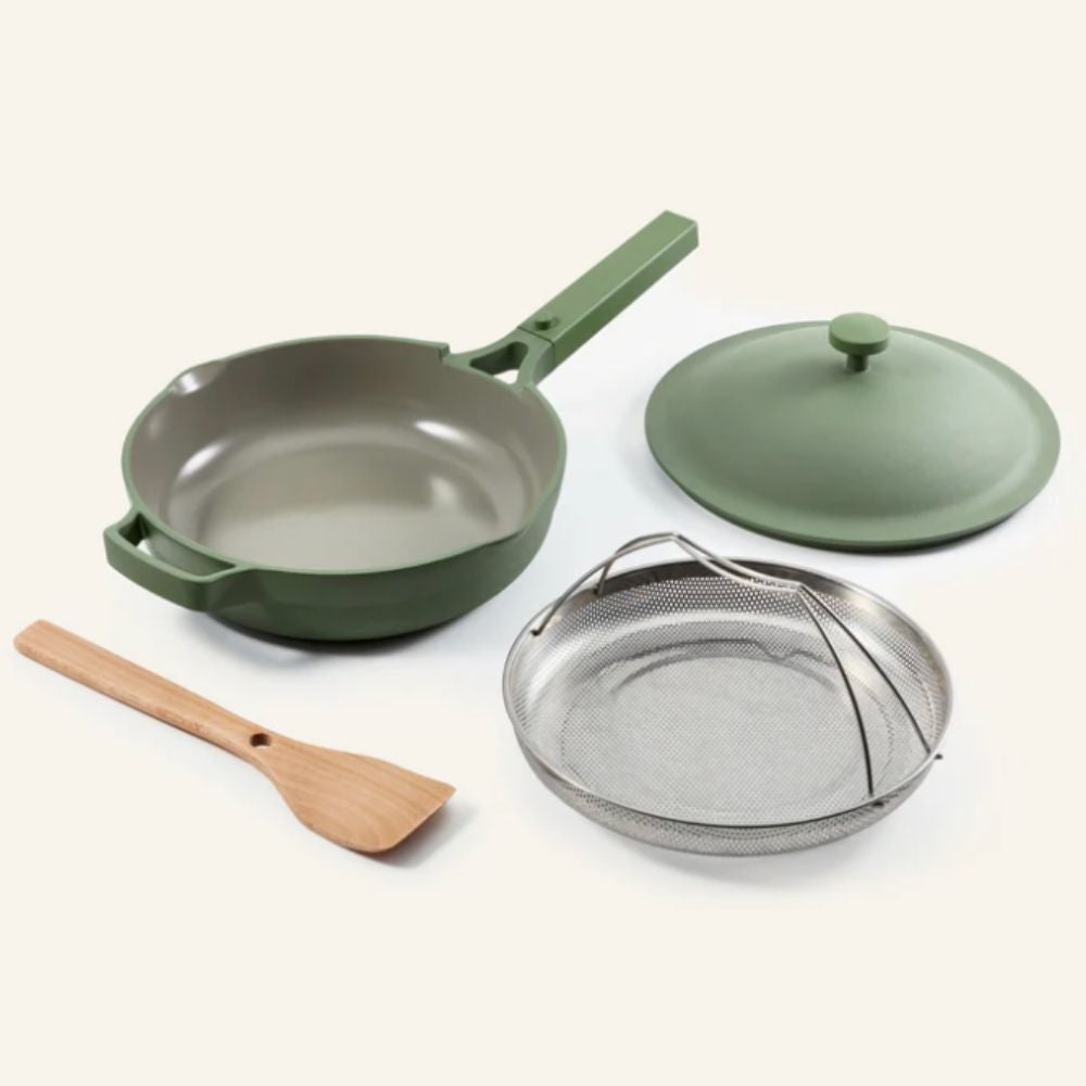 Multipurpose cookware acceptable   with a pan, lid, mesh basket, and woody  spatula, suitable for assorted  cooking tasks