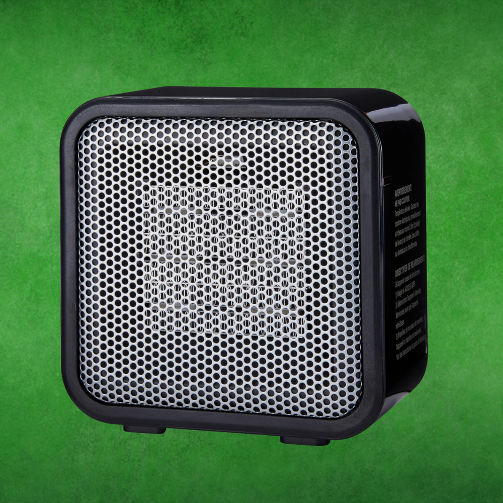 Compact portable talker  with metallic grille connected  a greenish  background, suitable for indoor and outdoor use