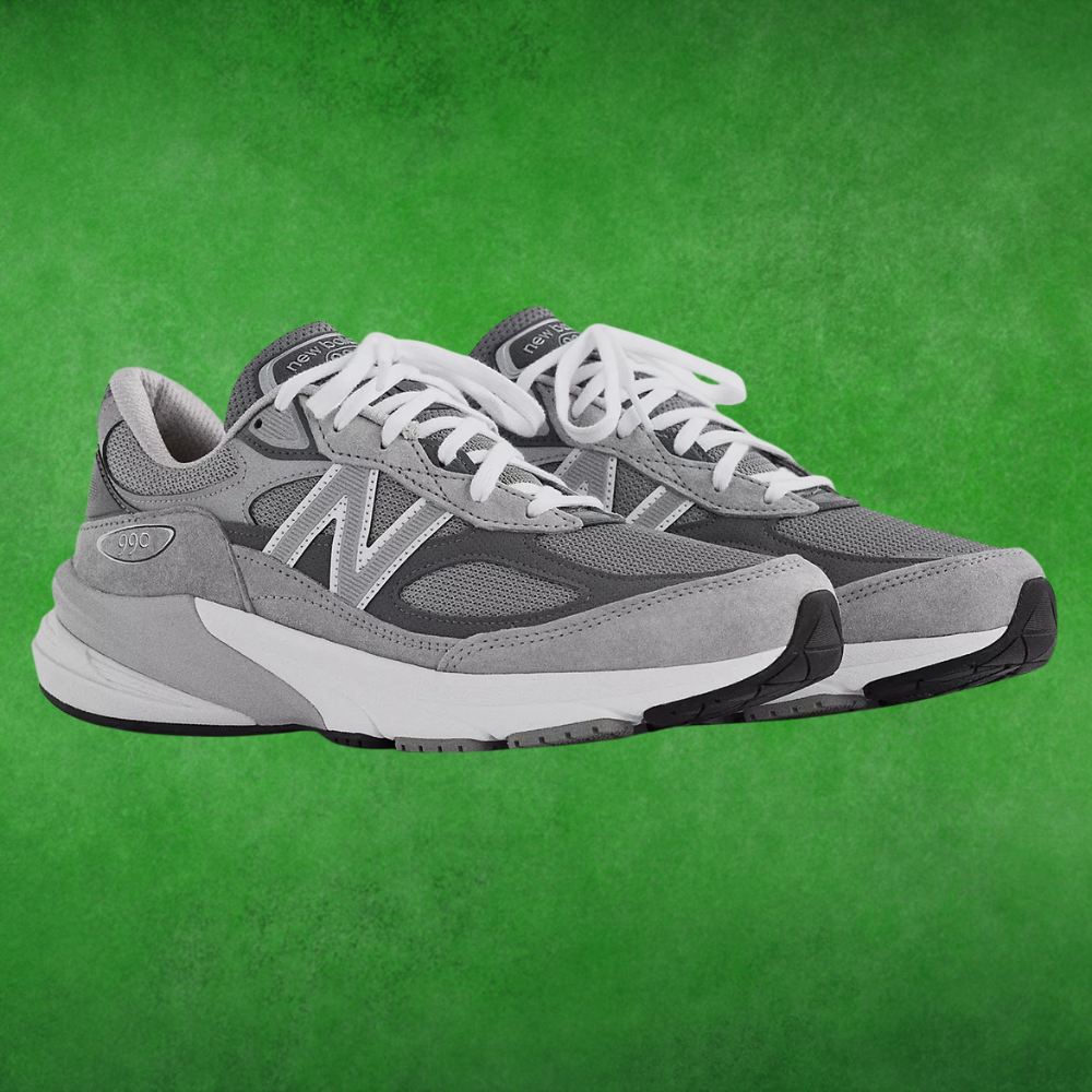 Gray diversion  sneakers with achromatic  laces connected  a greenish  background