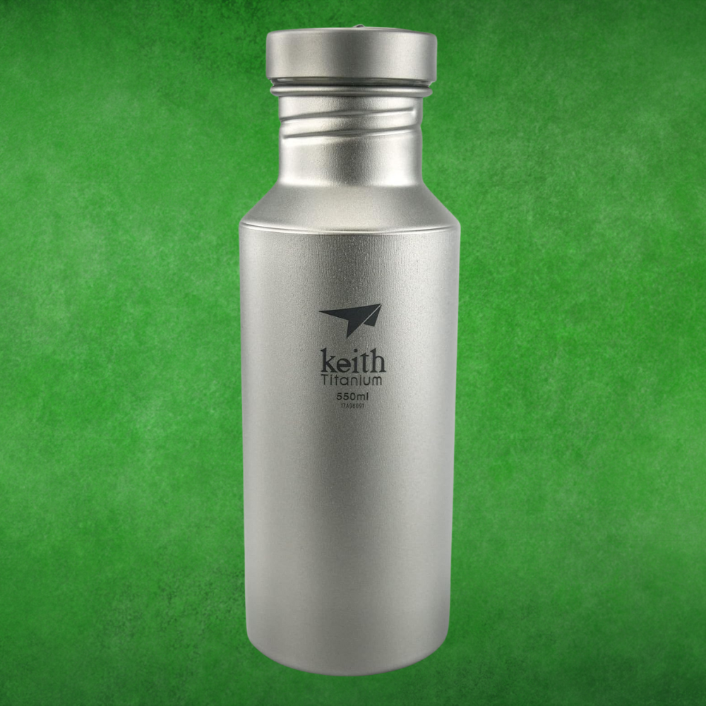 Metallic flask with "keith Titanium 550ml" logo, lasting  against a greenish  background. Featured successful  buying  content