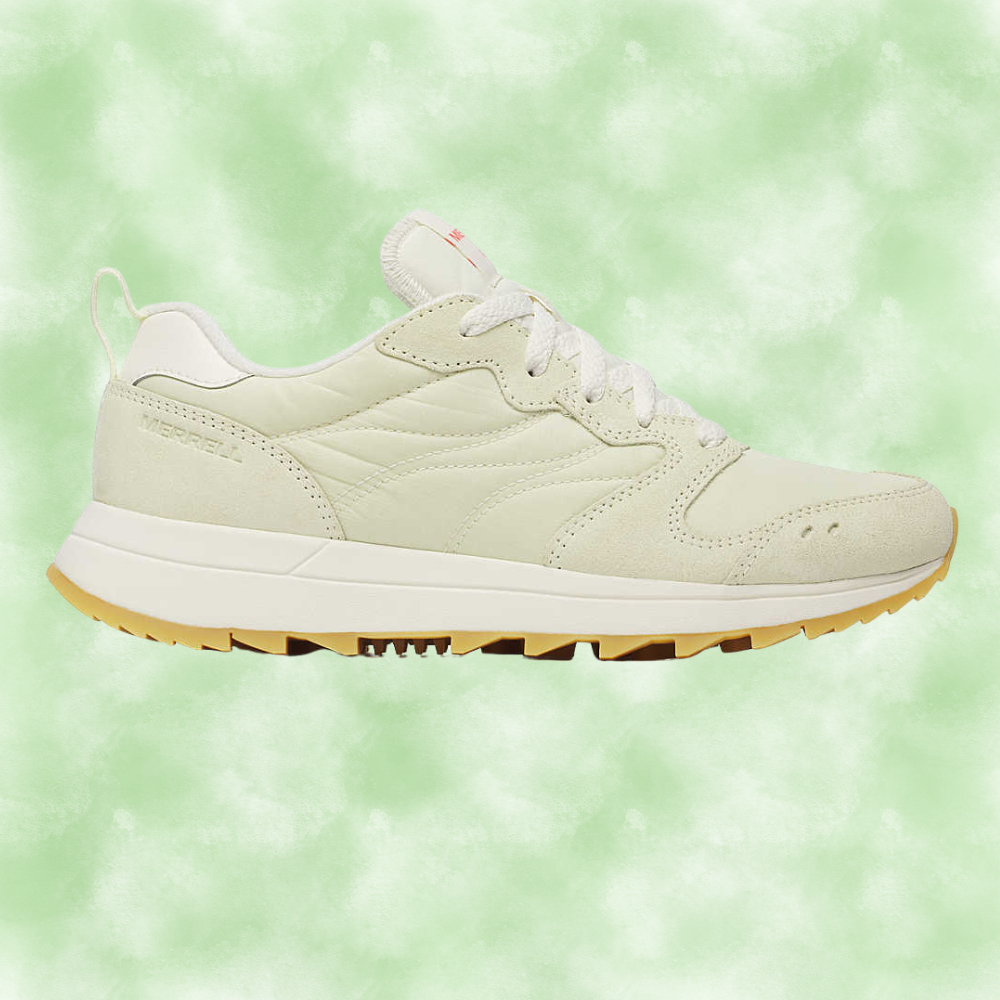 Lightweight sneaker with suede overlay and gum sole, perfect  for casual buying  trips. Background is simply a soft, abstract pattern