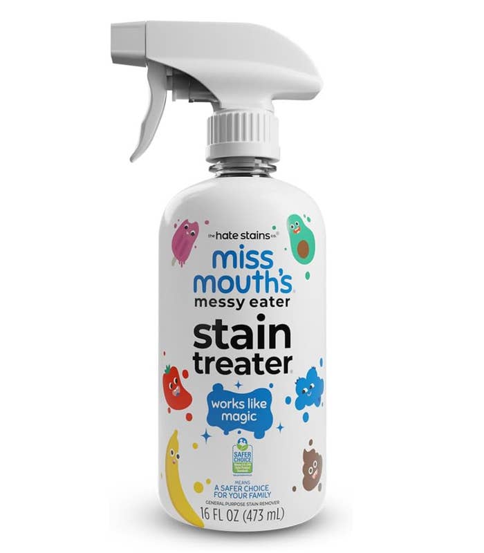 Bottle of "Miss Mouth's Messy Eater Stain Treater" with child-friendly stain graphics and a spray nozzle, labeled "works similar  magic."