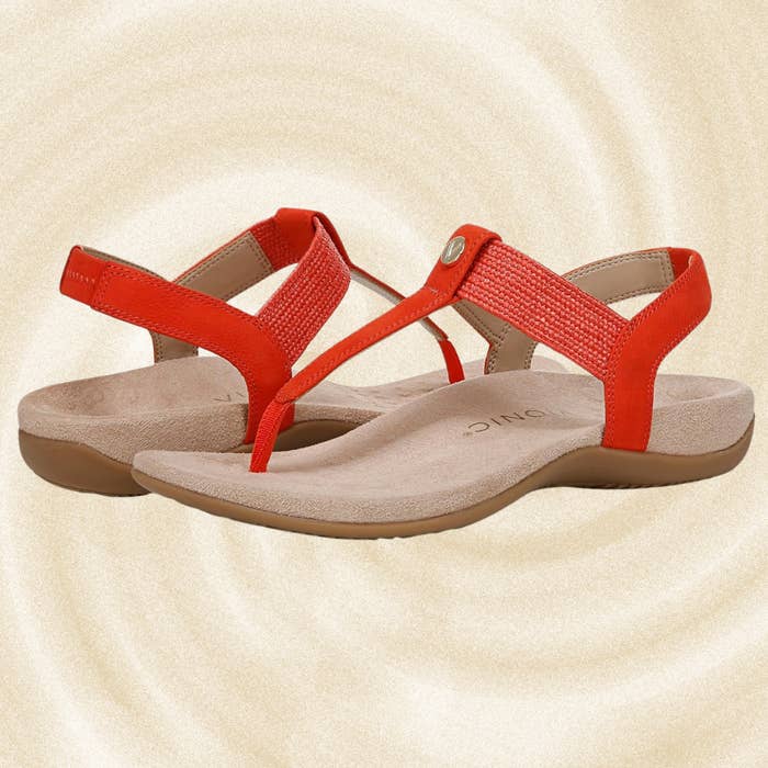 Orange open-toe sandals with ergonomic soles and textured straps, designed for comfortableness  and style