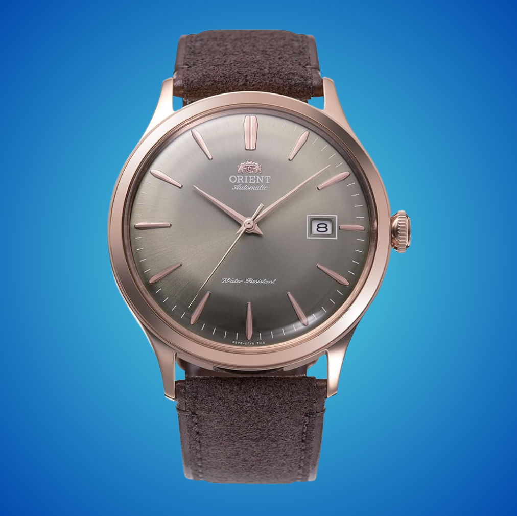 Orient ticker  with a classical  circular  face, leather strap, day  display, and blase  design, acceptable   against a coagulated  background