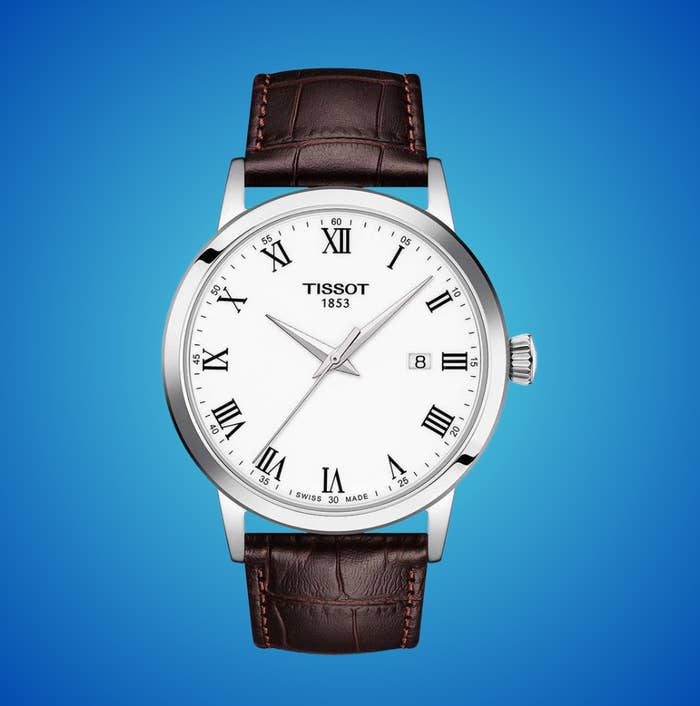 Tissot wristwatch with leather strap, Roman numeral dial, and day  display, acceptable   against a plain background