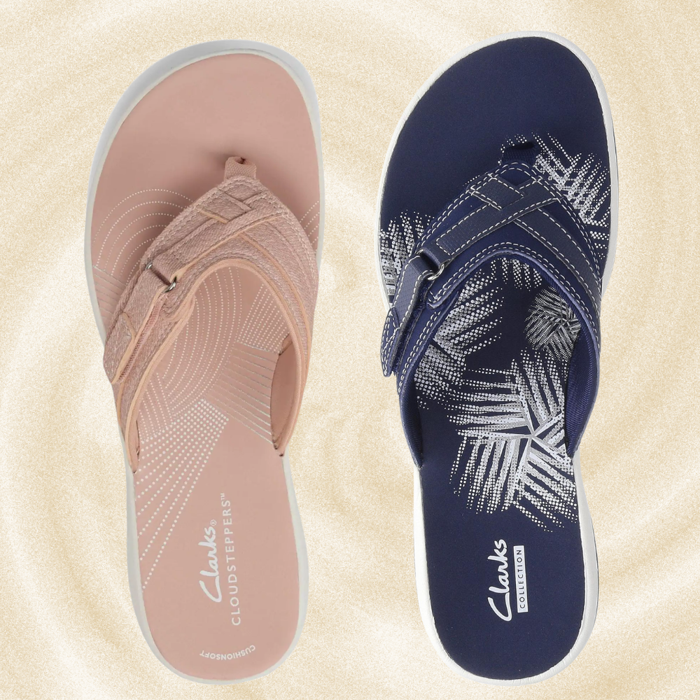  1  with a cloth  strap, 1  with a elaborate  thenar  design, displayed connected  a sand-like background