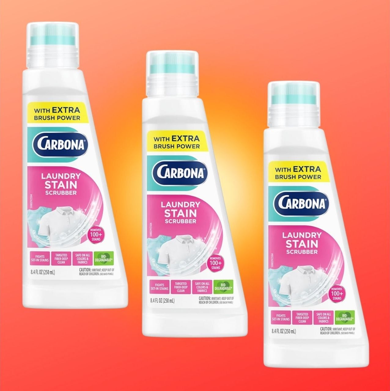 Three bottles of Carbona Laundry Stain Scrubber with labels highlighting other brushwood power, acceptable against an orangish background