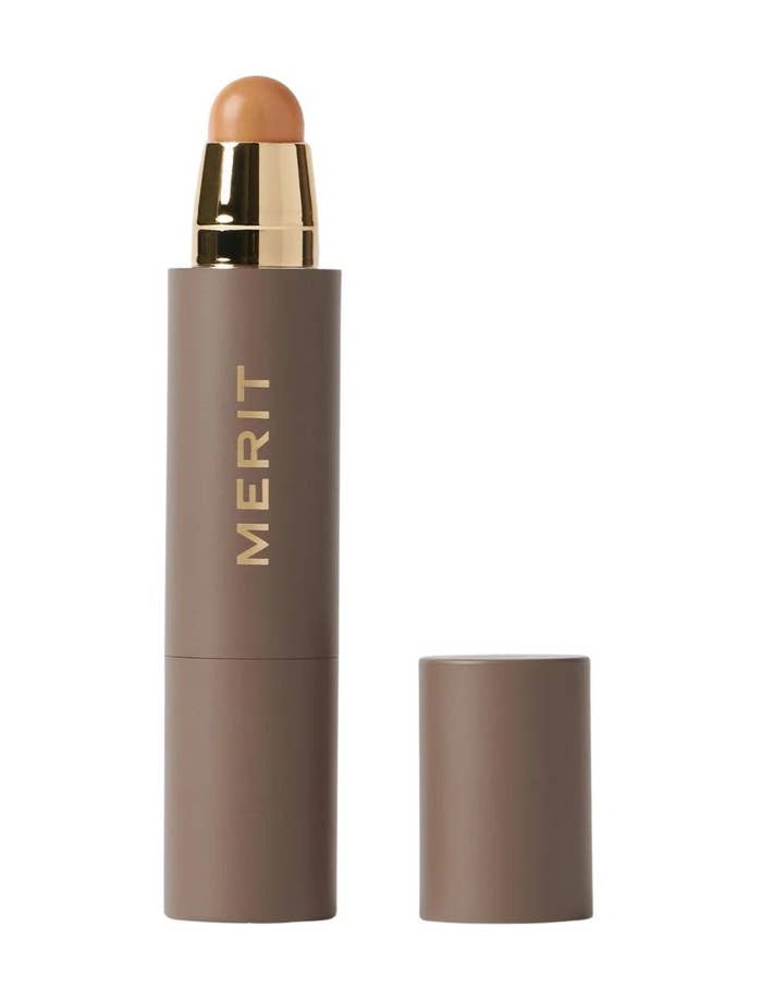 Merit constitution  instrumentality   with golden  accents and brownish  casing, headdress  removed and placed beside it