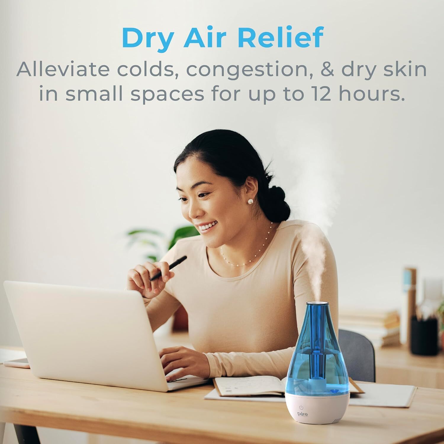 Person utilizing laptop with a humidifier connected  desk; substance   highlights humidifier's quality  to relieve colds, congestion, and adust  tegument  for up   to 12 hours