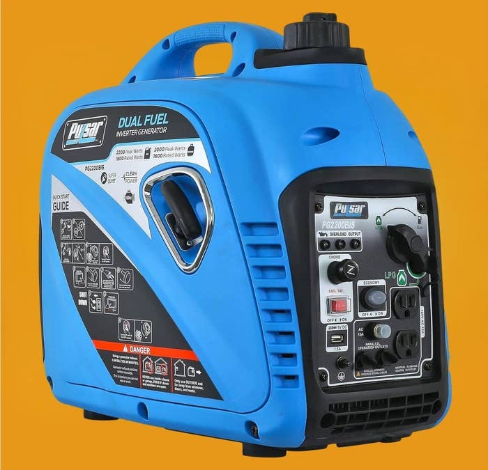 Portable dual-fuel inverter generator with power  panel, outlets, and information   instructions displayed connected  its side