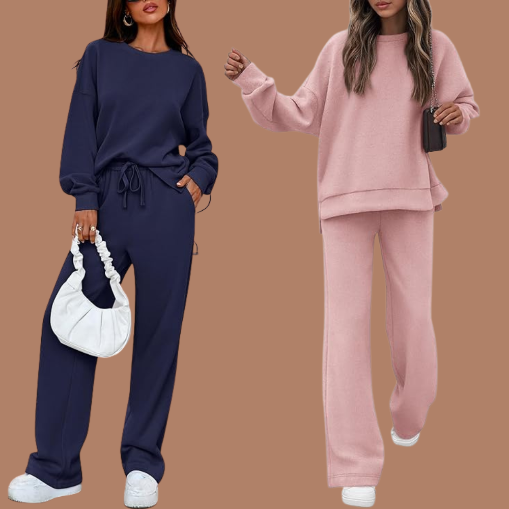 Two models successful  casual, loose-fitting lounge sets and sneakers. One wears navy; the different   airy  pink. Both clasp  bags, suited for a relaxed, trendy look