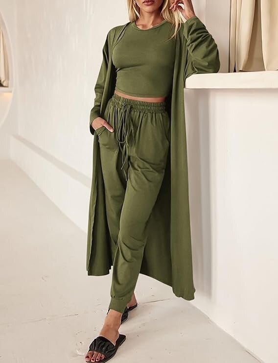 Model successful  a matching casual acceptable   with a agelong  duster, harvest  top, and jogger pants, styled with descent  sandals