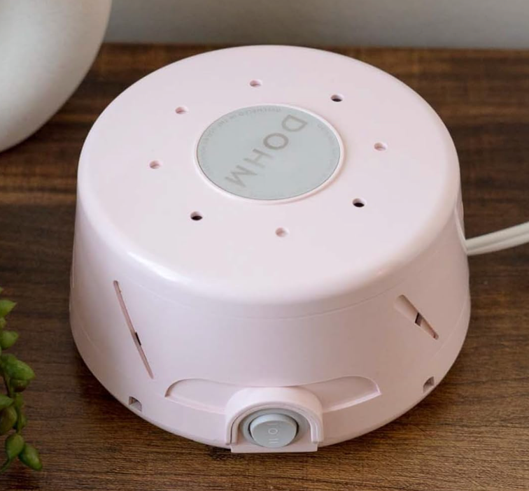 White sound  instrumentality   connected  a woody  table, offering relaxation and amended  sleep