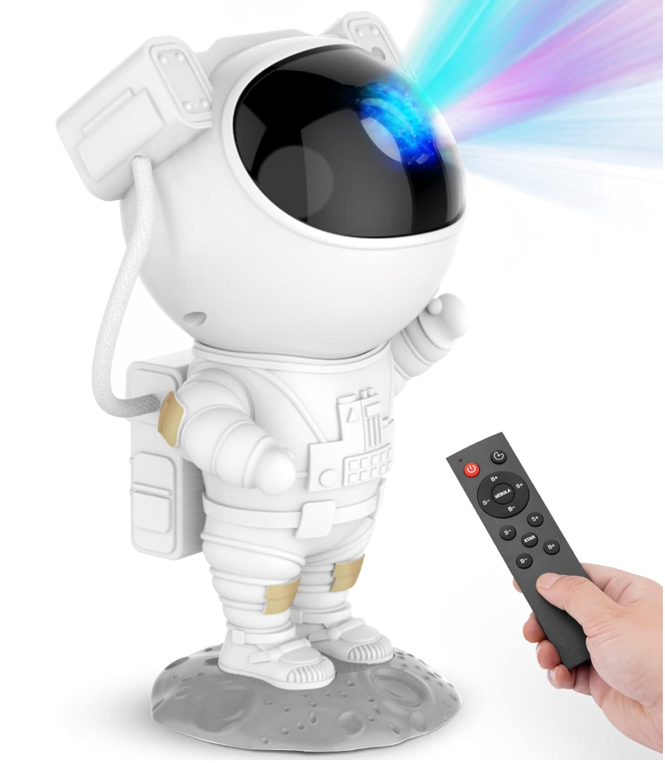 Astronaut-shaped nighttime  airy  projector connected  a satellite  base, projecting colorful lights, with a manus  holding a distant    power  successful  the foreground
