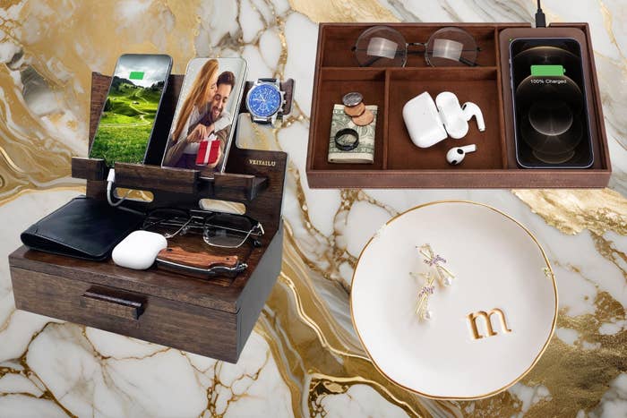 Organizer with compartments for phone, glasses, watch, and tablet, shown with electronics and accessories placed connected  a marble surface