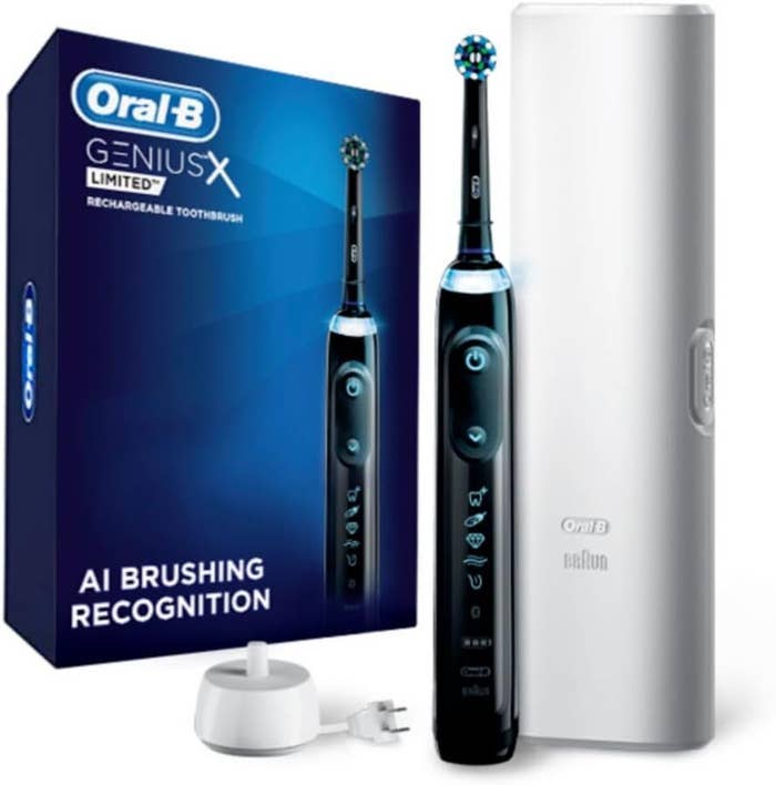 Oral-B Genius X Limited electrical  toothbrush with AI brushing recognition, shown with its box, charging stand, and question   case