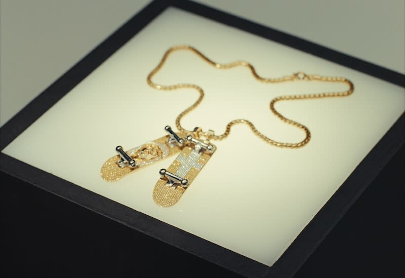 lv skateboard necklace