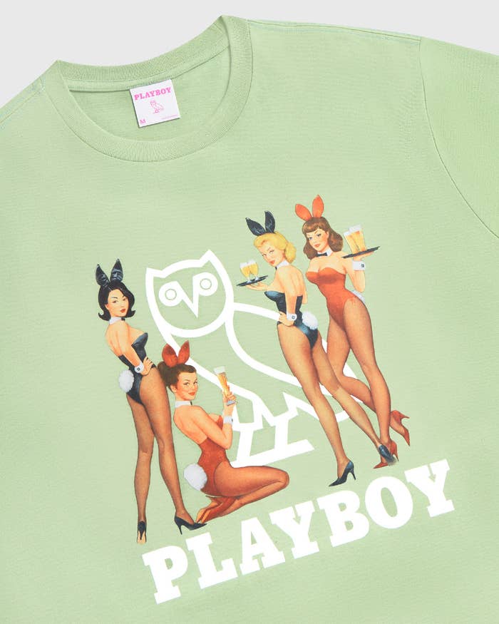 A sage green shirt with the OVO owl surrounded by pinup Playboy bunnies.