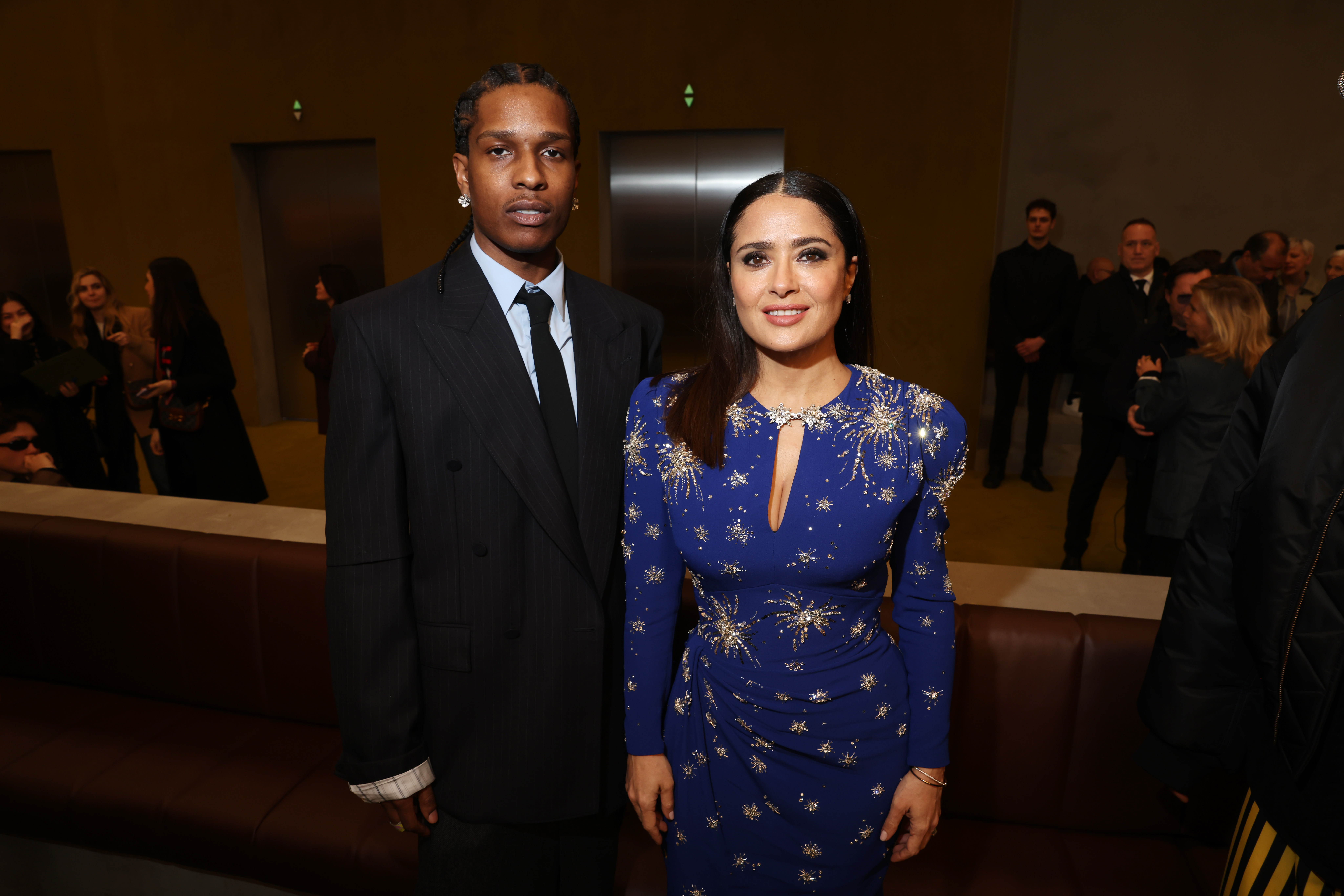 Image of ASAP Rocky and Salma Hayek at Gucci show.