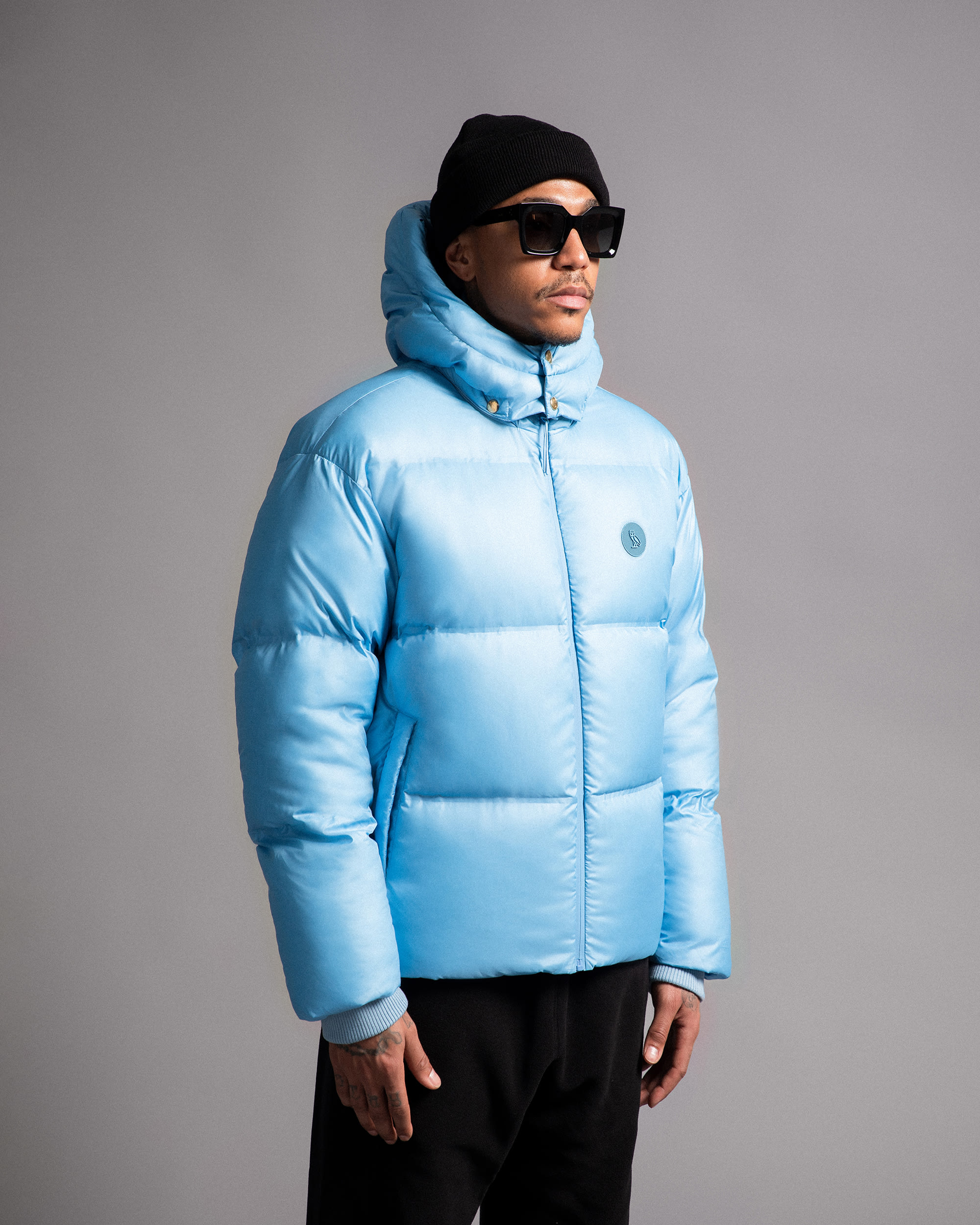 Model in light blue puffer coat