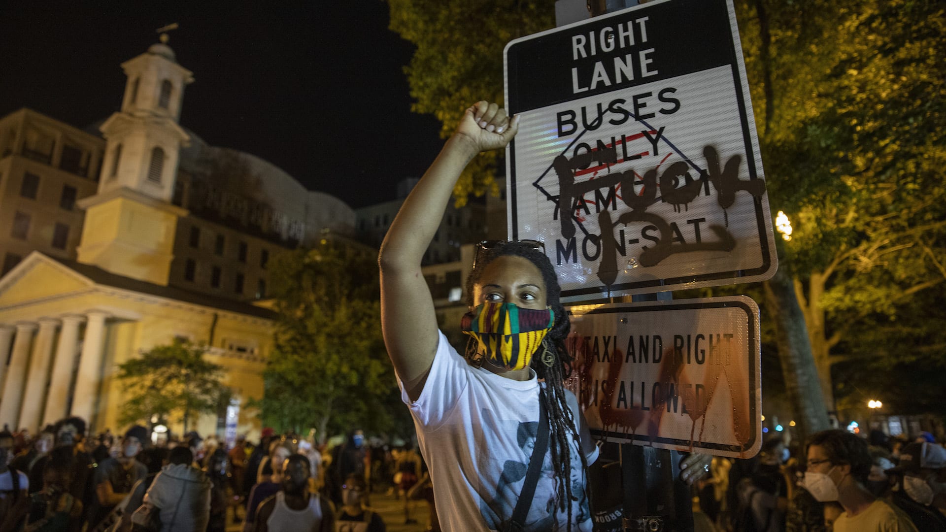 Police work to keep demonstrators back during a protest