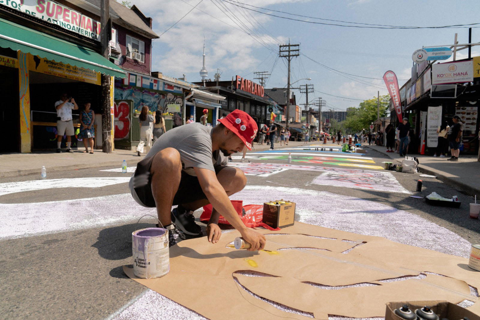 Yung Yemi doing graffiti art