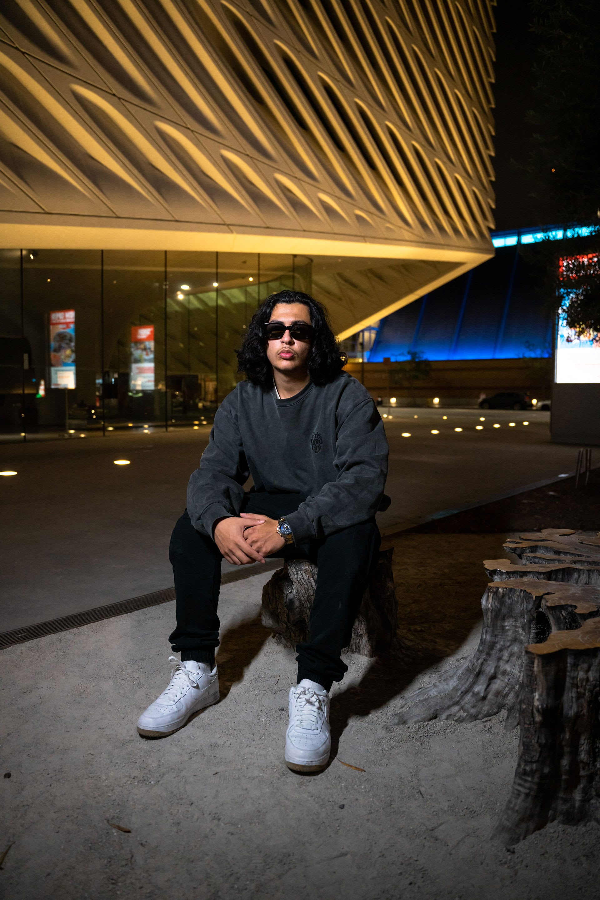 RealestK Toronto artist posing in front of auditorium