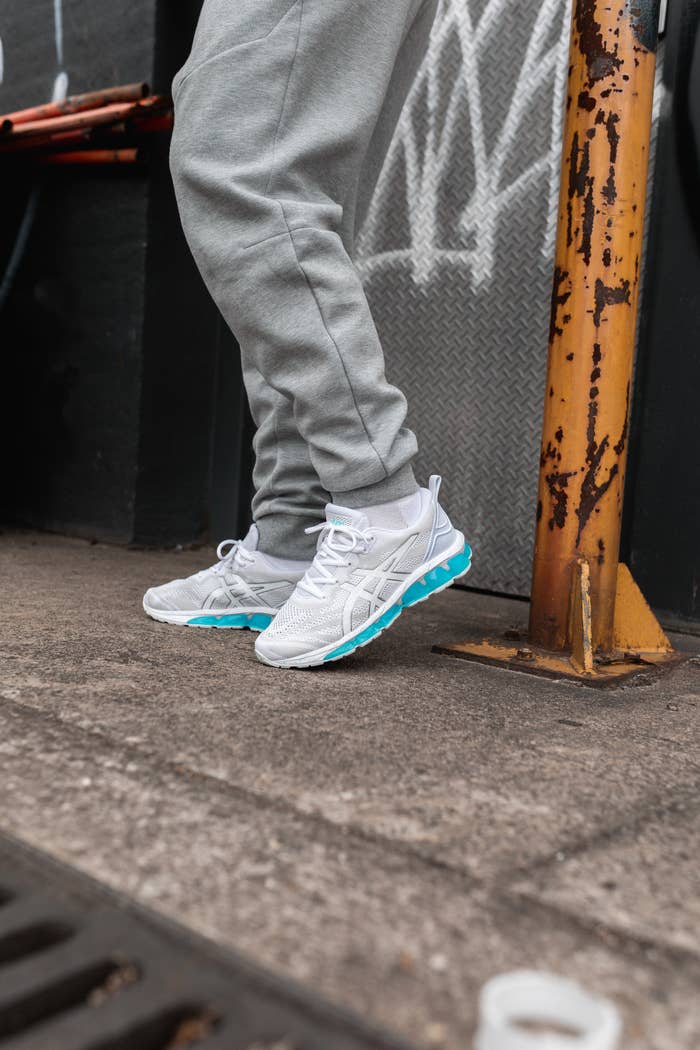 JD Sports Tokyo Neon runner on a concrete platform, blue and white