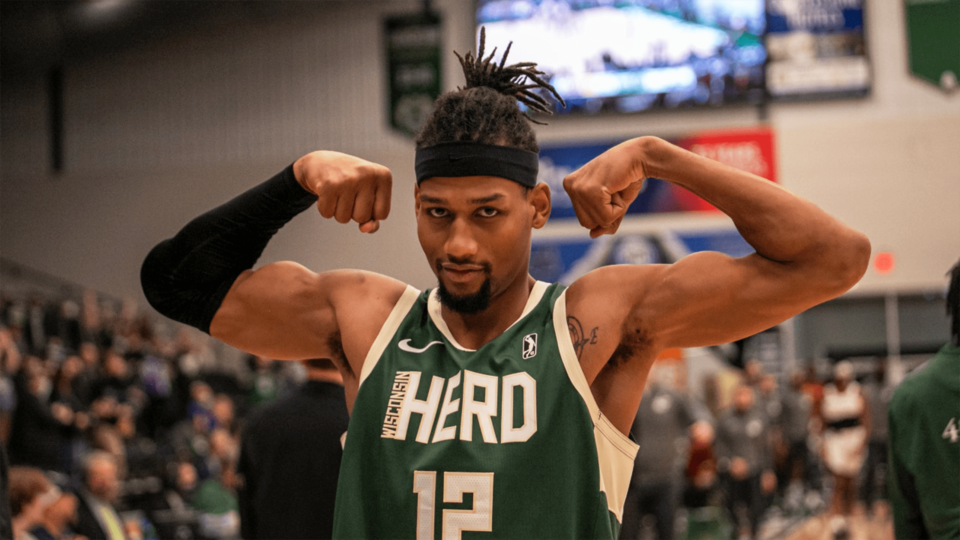 Javin DeLaurier flexing his harms on the basketball court.