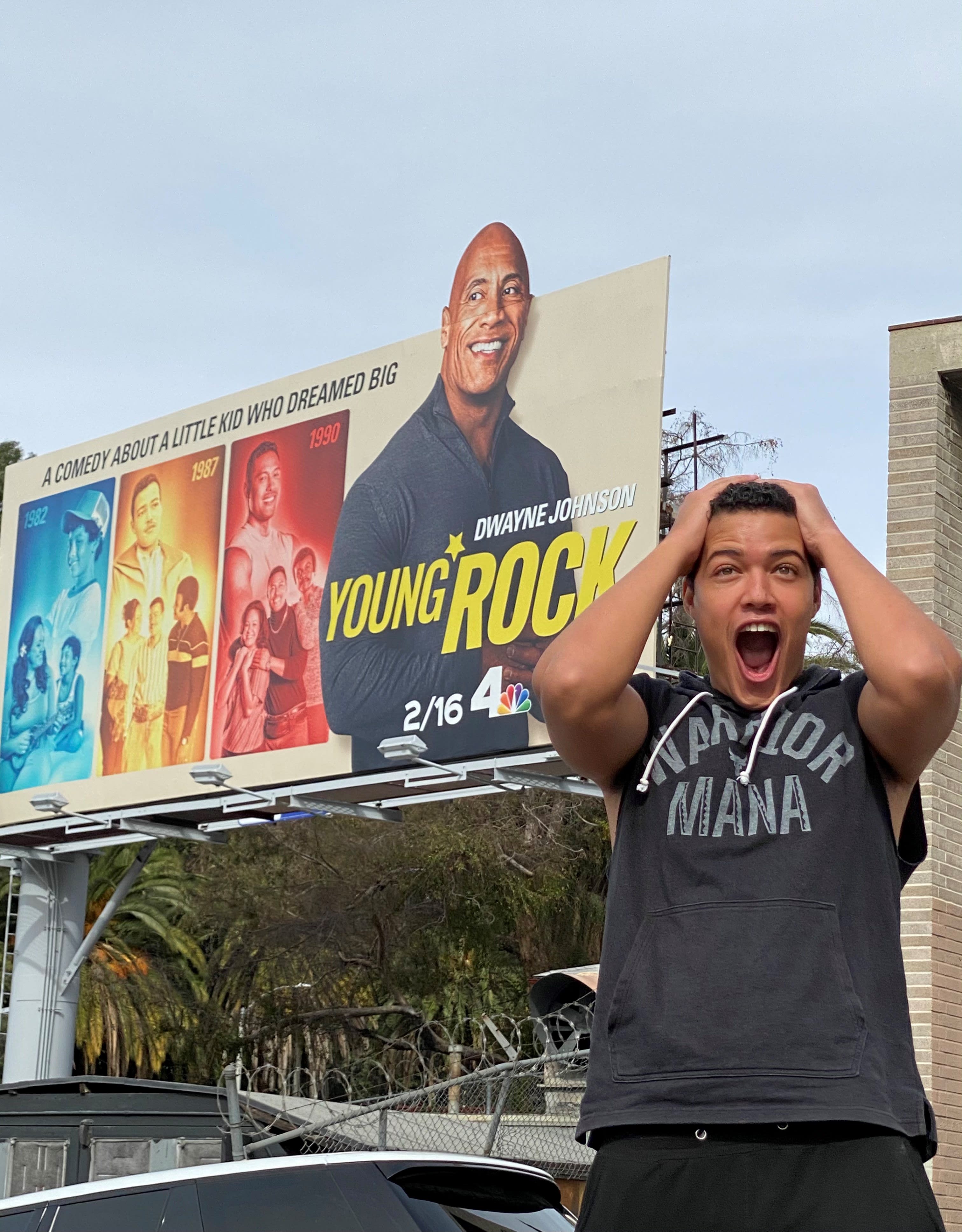 Bradley Constant outside of &#x27;Young Rock&#x27; billboard in Hollywood