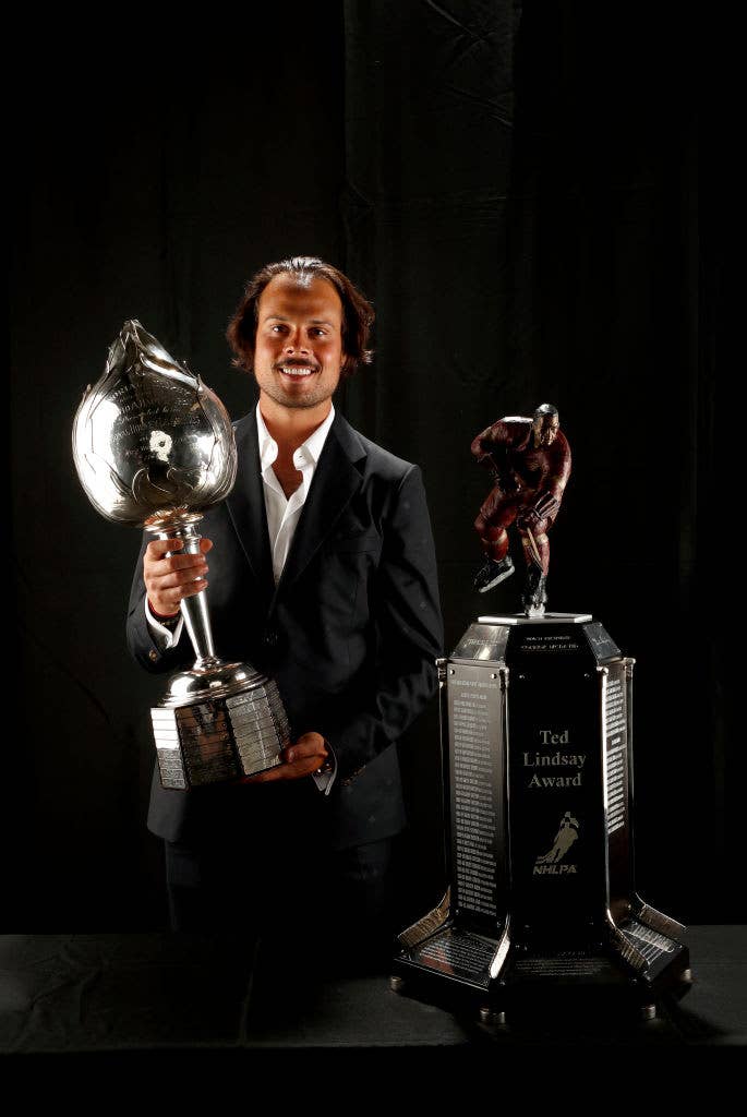 Auston Matthews poses with the Hart Trophy