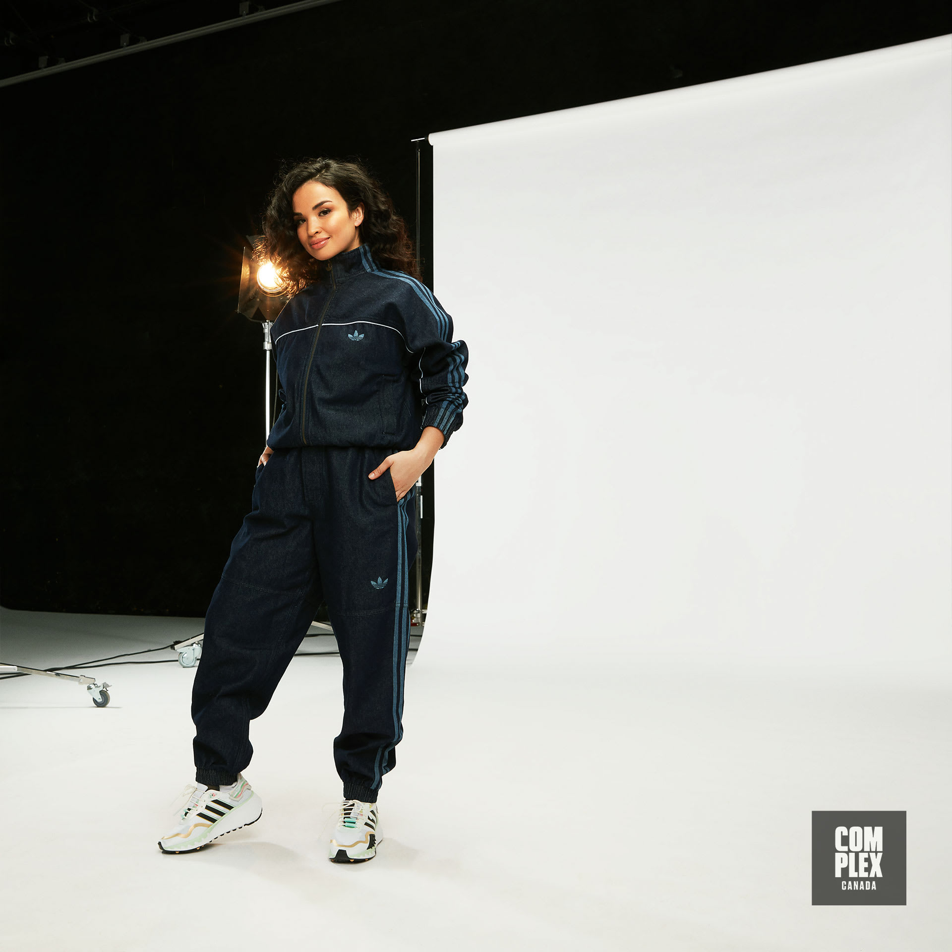 Toronto upcycling artist Natalya Amres poses in adidas RYV