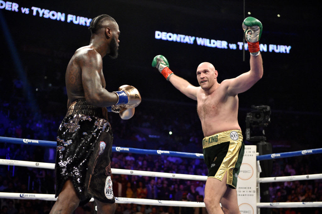 Tyson Fury Deontay Wilder Arms Up 2018 Getty