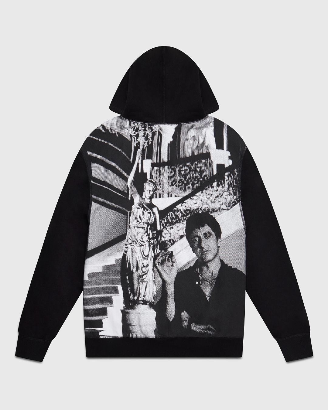 A black hoodie picturing Tony Montana (Al Pacino) in monochrome smoking a cigar.