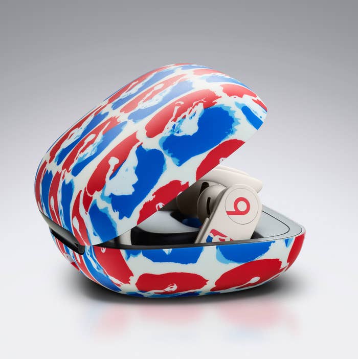 A Powerbeats Pro case featuring an abstract version of the NBA logo in red and blue.