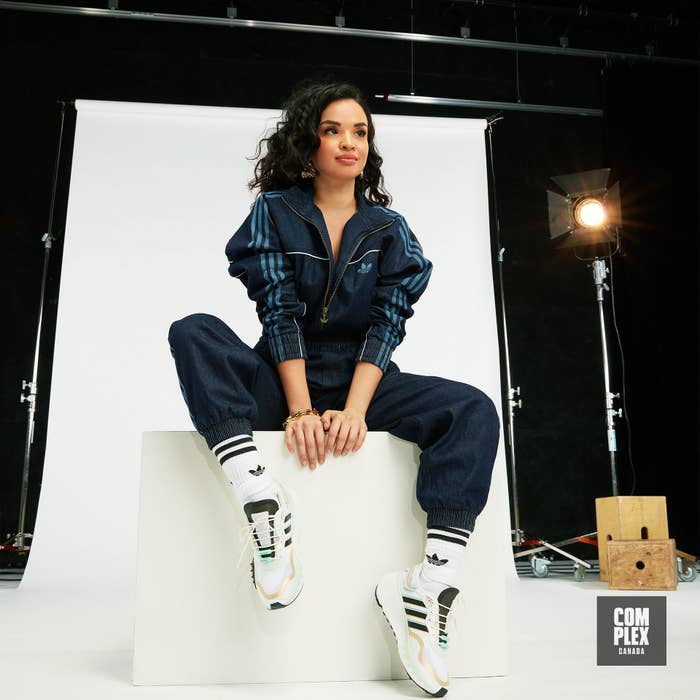 Toronto upcycling artist Natalya Amres poses in adidas RYV