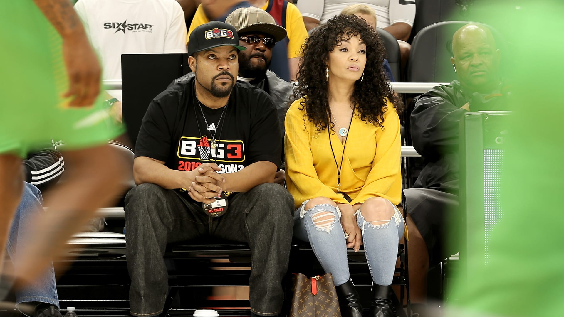 Ice Cube and wife Kimberly Woodruff look on during BIG3 Week Seven in 2019