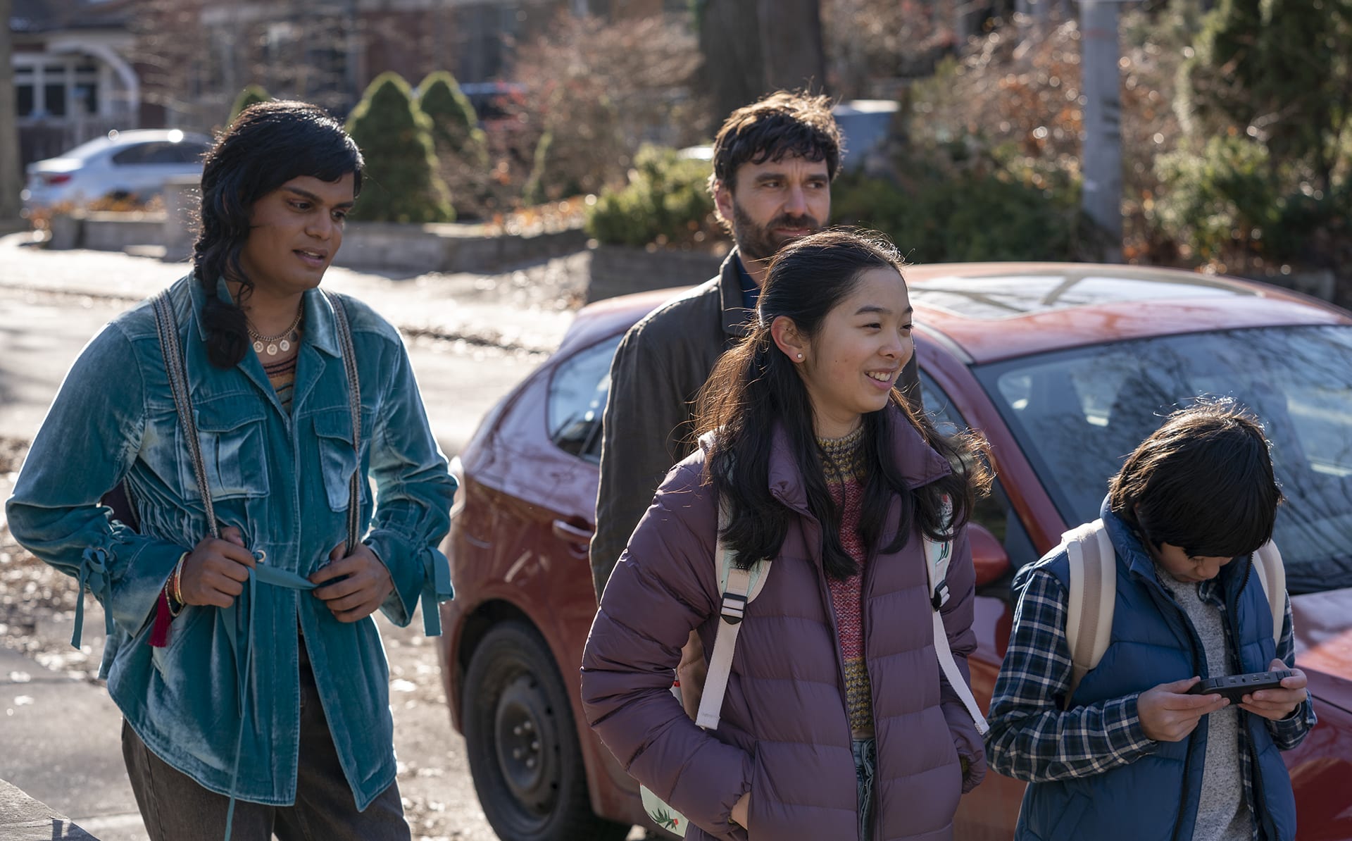 Bilal Baig as Sabii walking with other cast mates for new CBC series Sort Of.