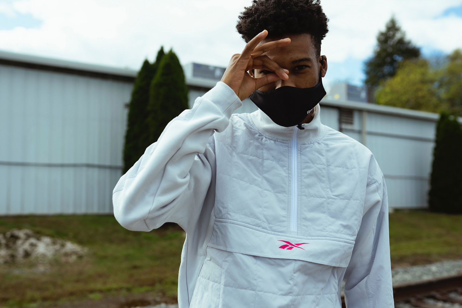 Canadian runner Justyn Knight poses in Reebok windbreaker