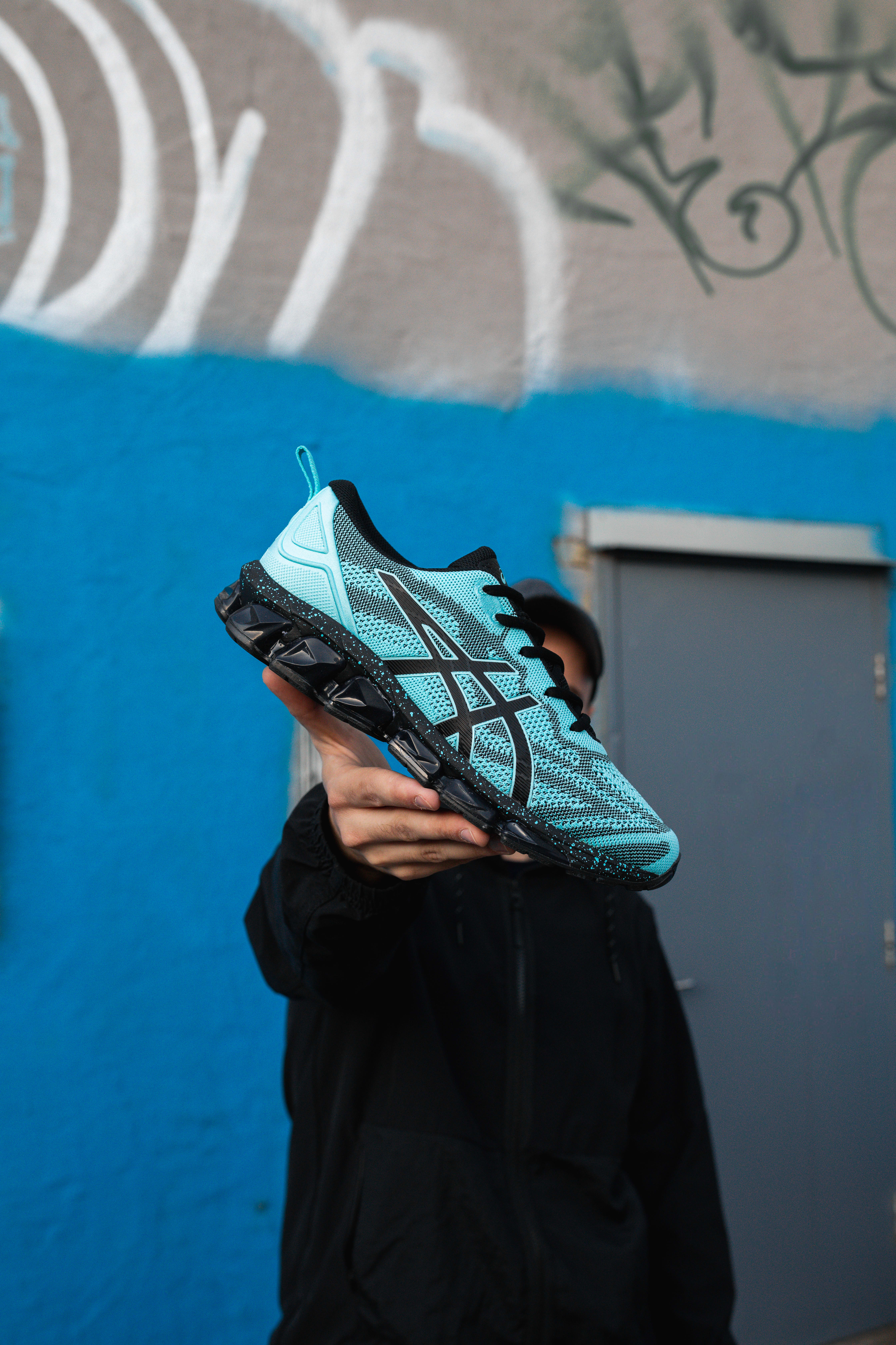 JD Sports Tokyo Neon runner on a concrete platform, blue and white