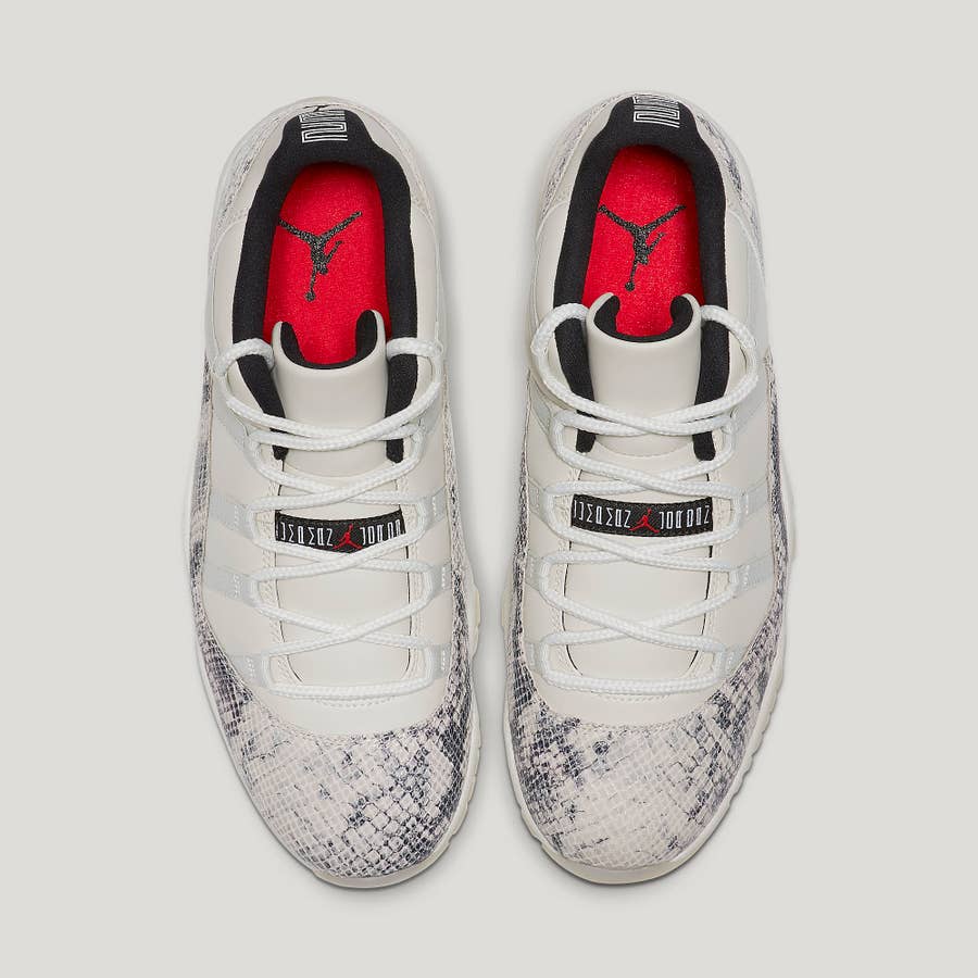 Jordan 11 low snakeskin best sale light bone on feet