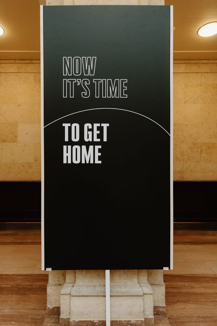 White text on a black background that says &quot;NOW IT&#x27;S TIME TO GET HOME&quot;