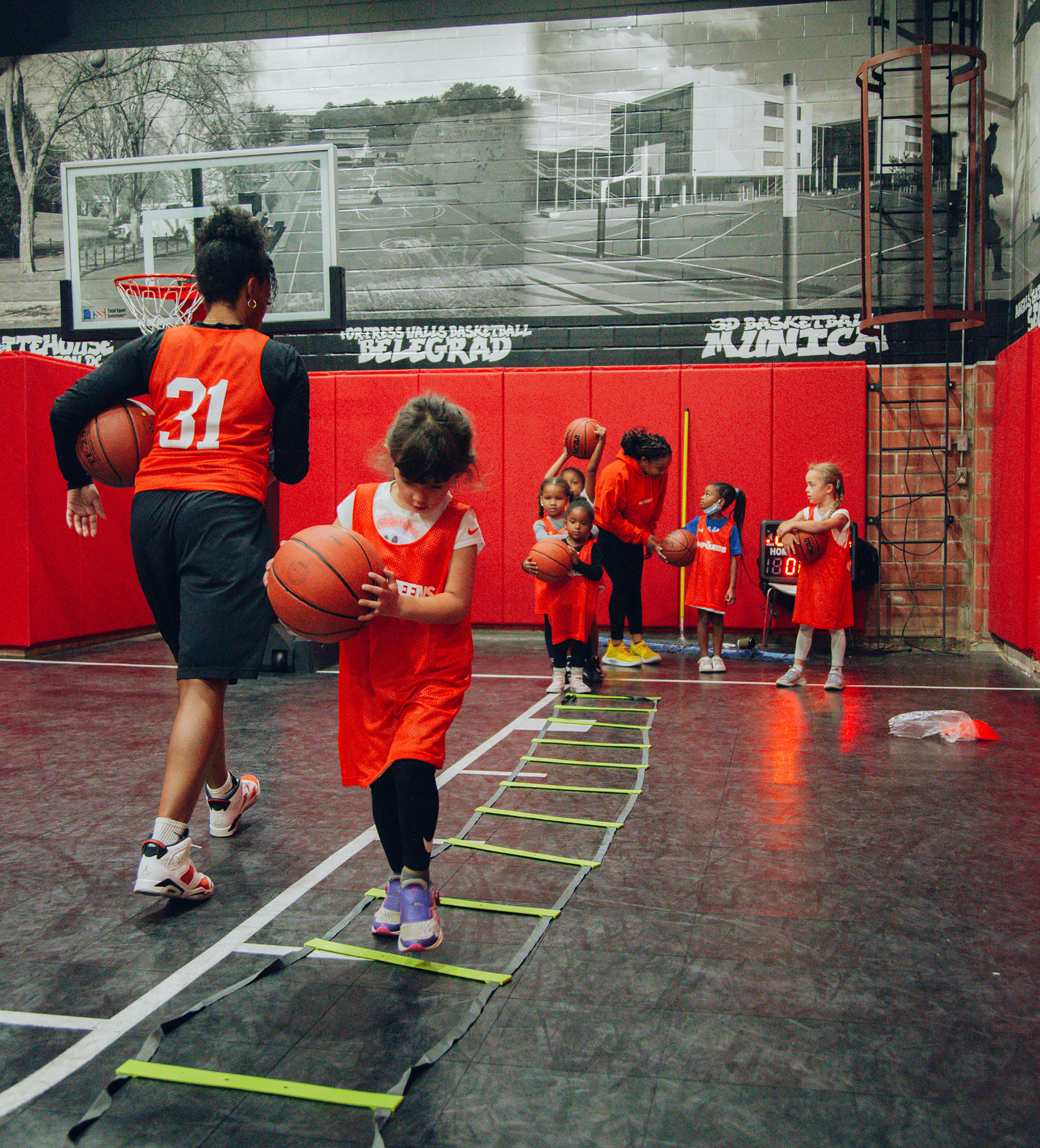Girls practising basketball in HoopQueens summer league
