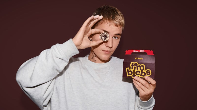 Justin Bieber poses with Tim Hortons Timbiebs