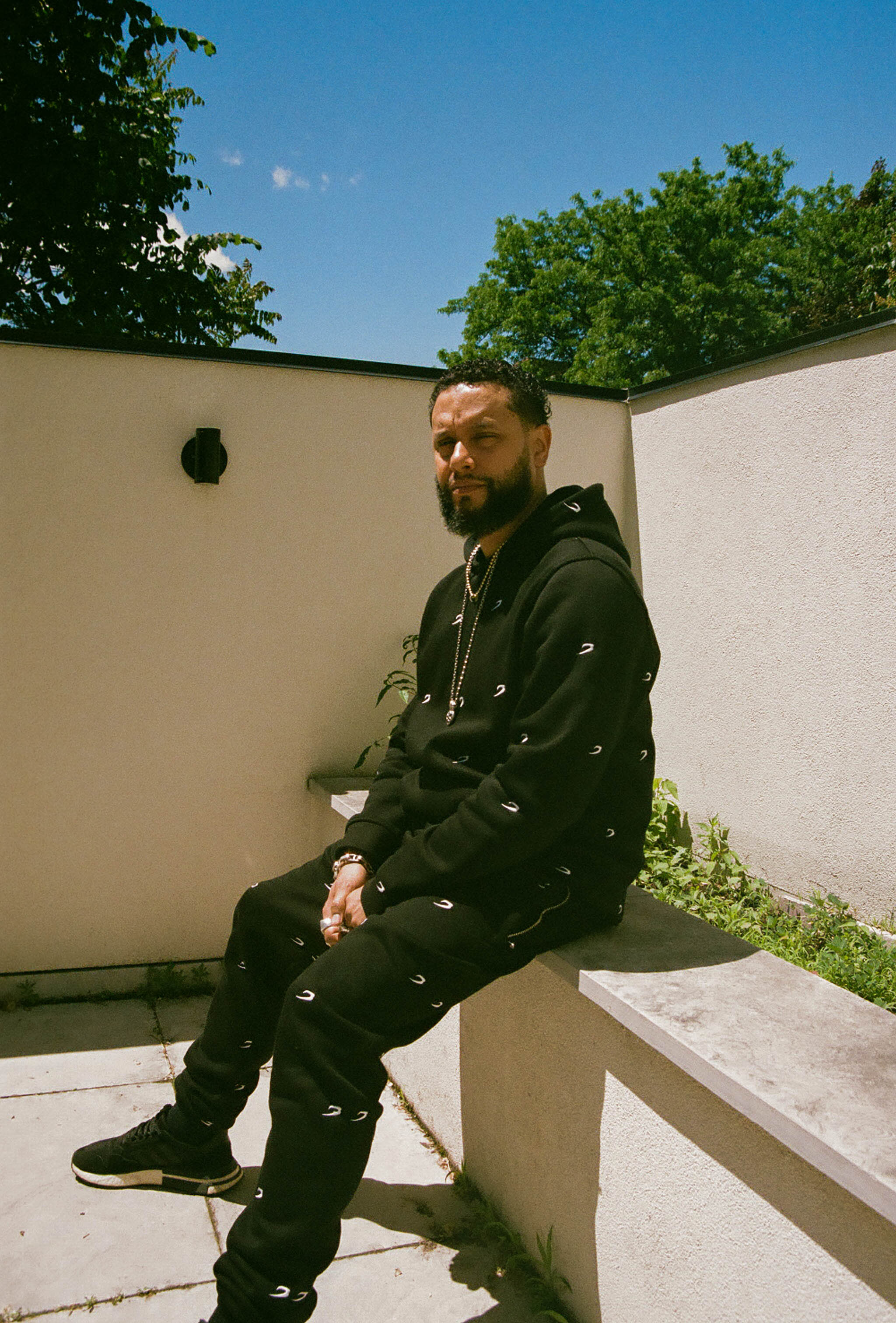 Director X sitting outside