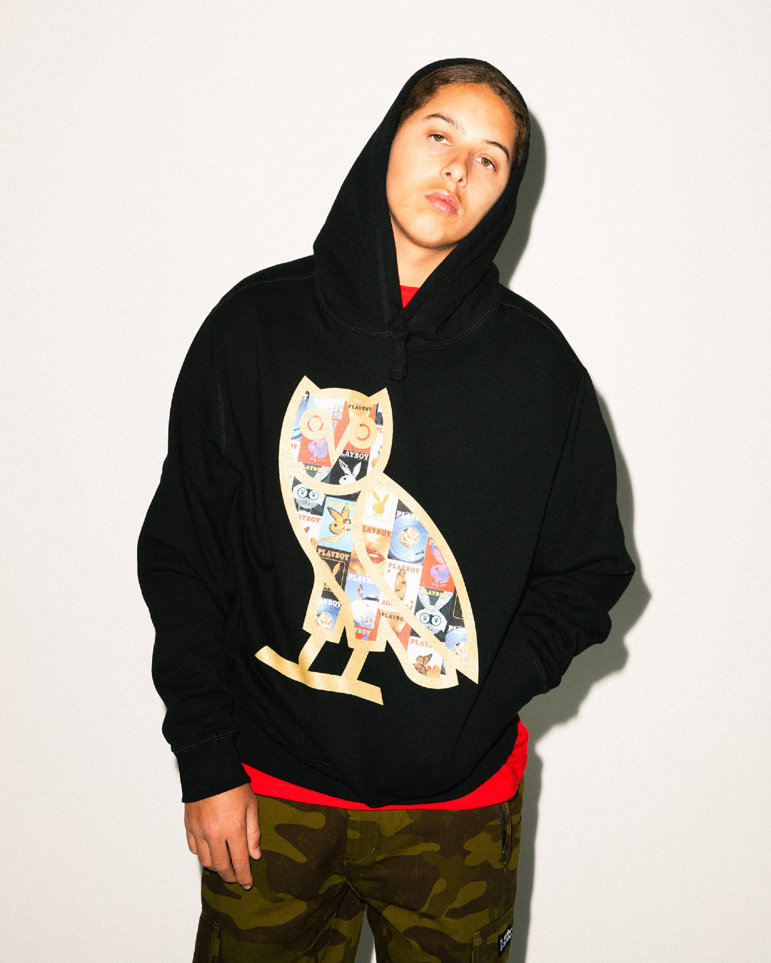 A black hoodie with the OVO owl featuring Playboy covers.