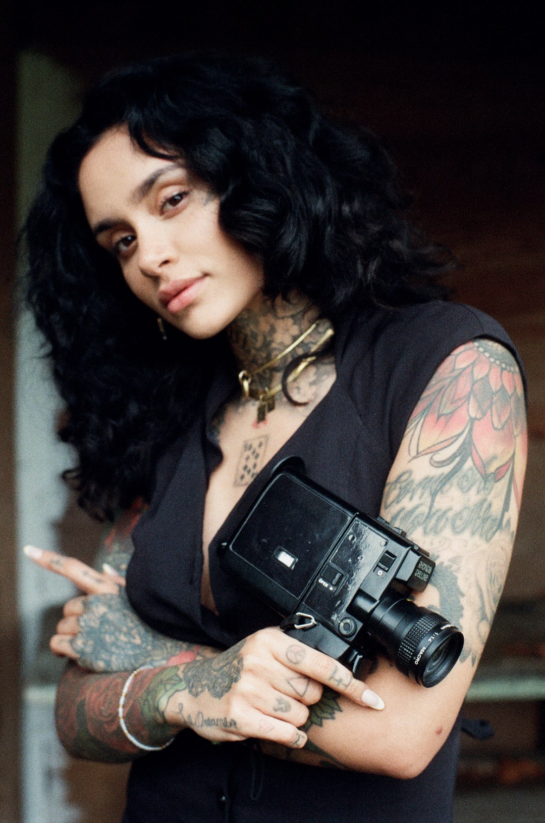 Kehlani holding a camera