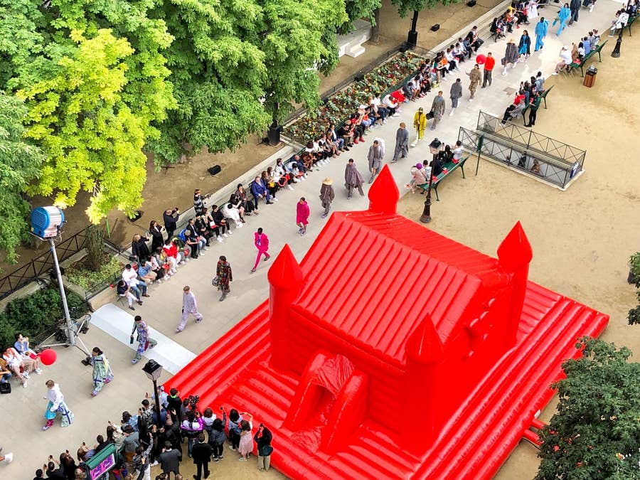 A red bouncy castle in the middle of a beautiful square in Paris