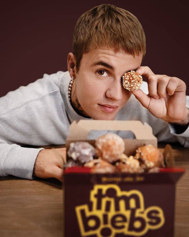 Justin Bieber posing with his new Timbeibs Timbits