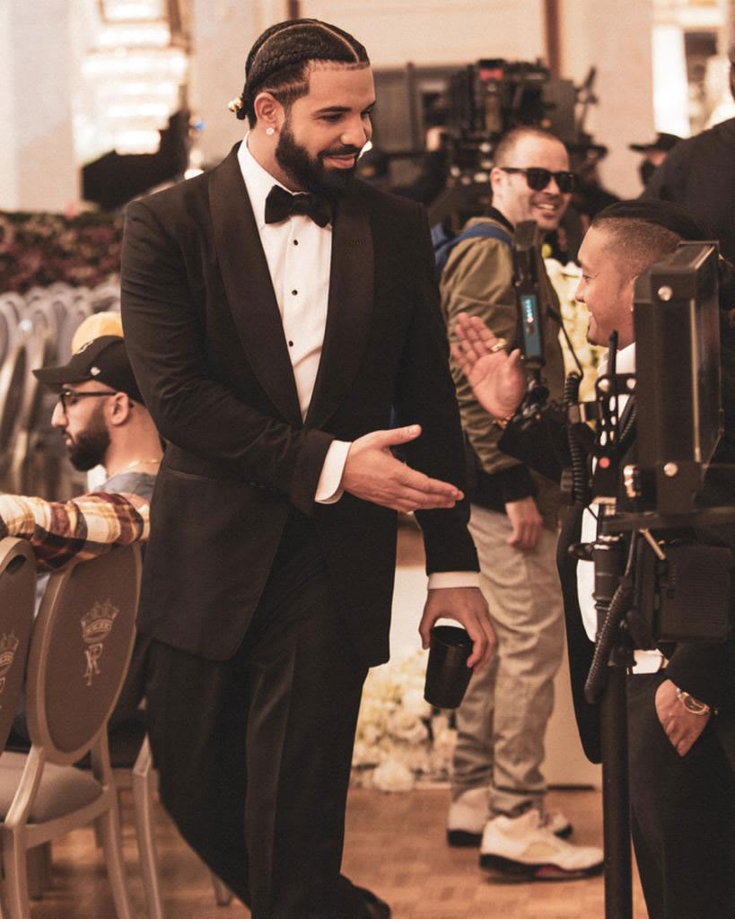 Drake shaking Mr. Standout&#x27;s hand on the set of his &quot;Falling Back&quot; video